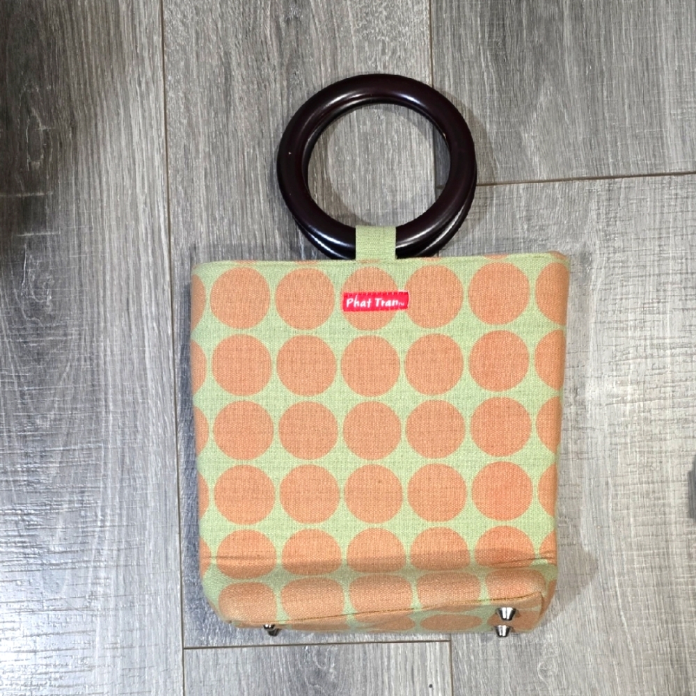 Phat Tran Saigon. Chic Polka Dot Tote with Dark Handles.